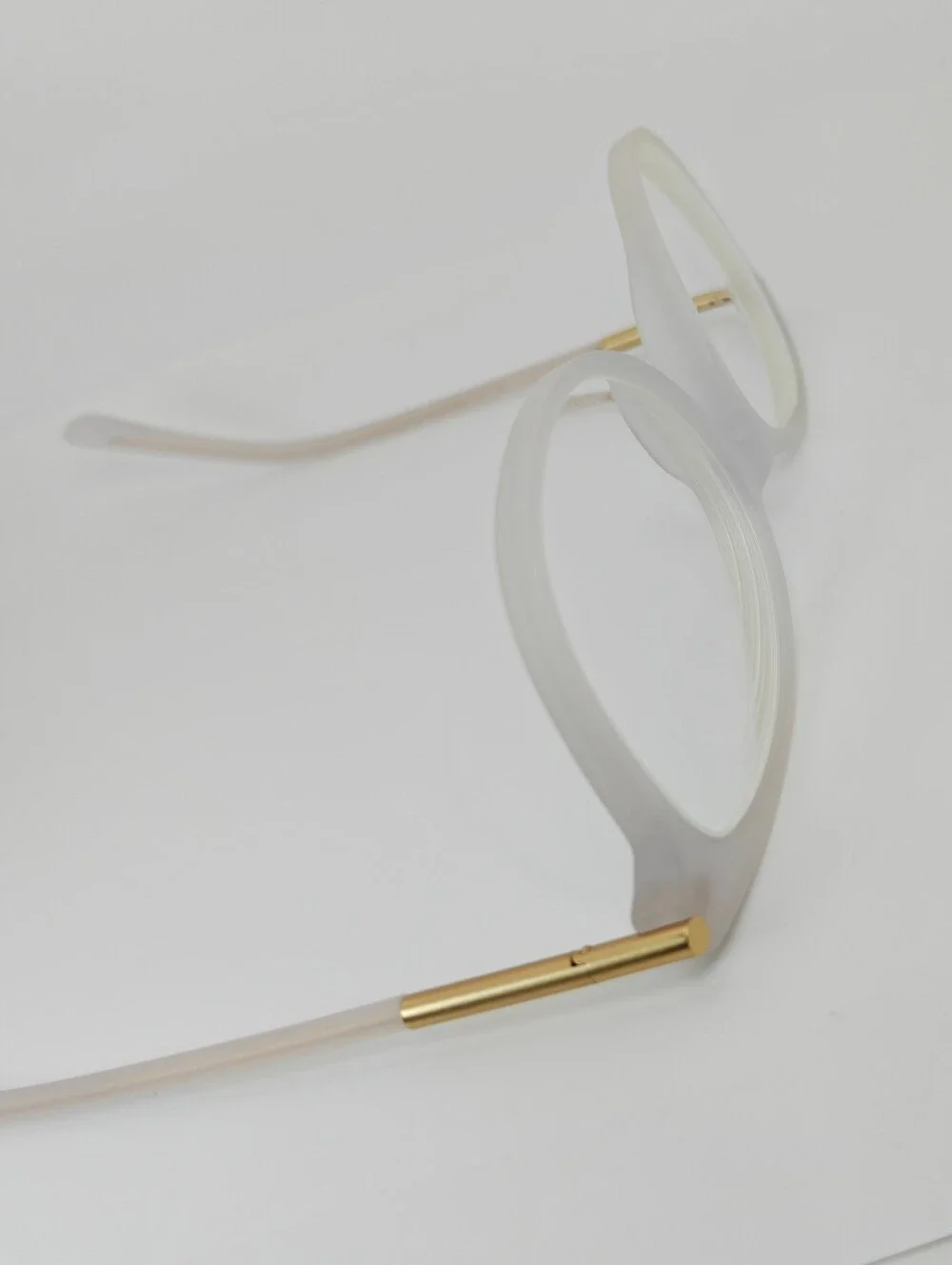 Cylinder. Women's Frosted White Round Frame Glasses. Cylinder Gold Highlights.